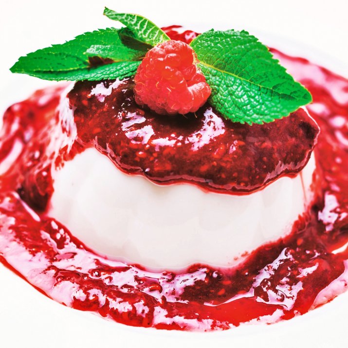 42729514-panna-cotta-with-raspberry-sauce-and-mint-leaf